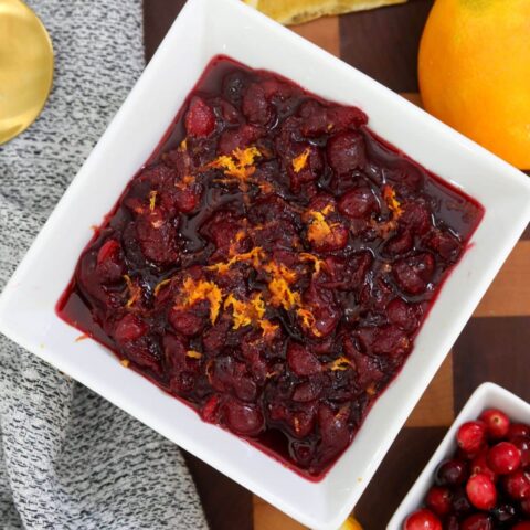 Cranberry sauce in a white square bowl