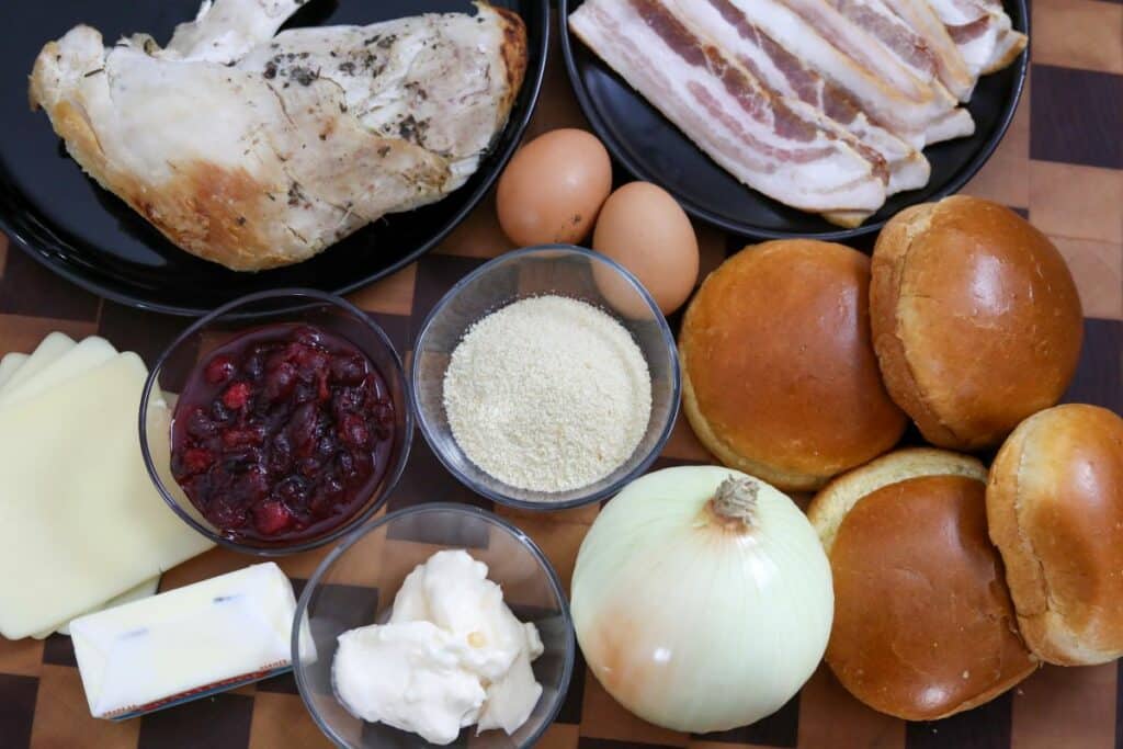 Ingredients for turkey burgers on a wooden cutting board