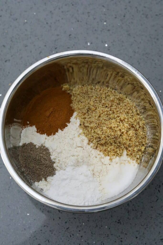 Dry ingredients for the upside down cake in a metal bowl