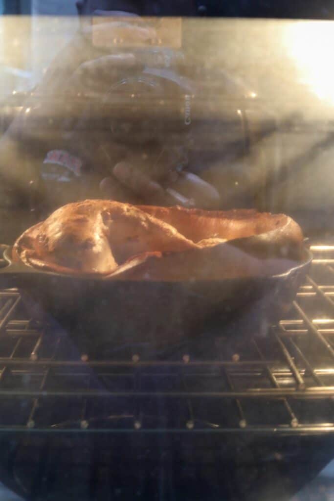 Dutch baby rising in the oven