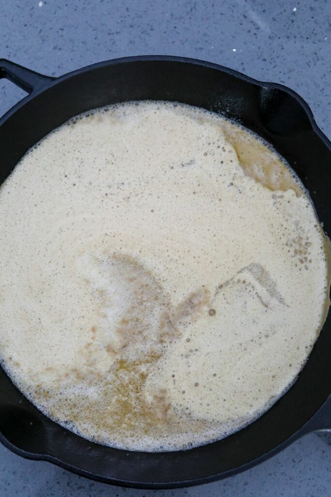 Batter added to the cast iron skillet