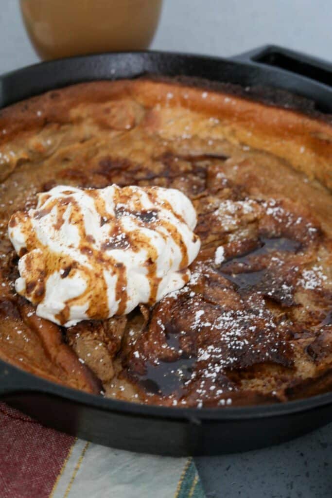 Cast iron skillet with a gingerbread Dutch baby