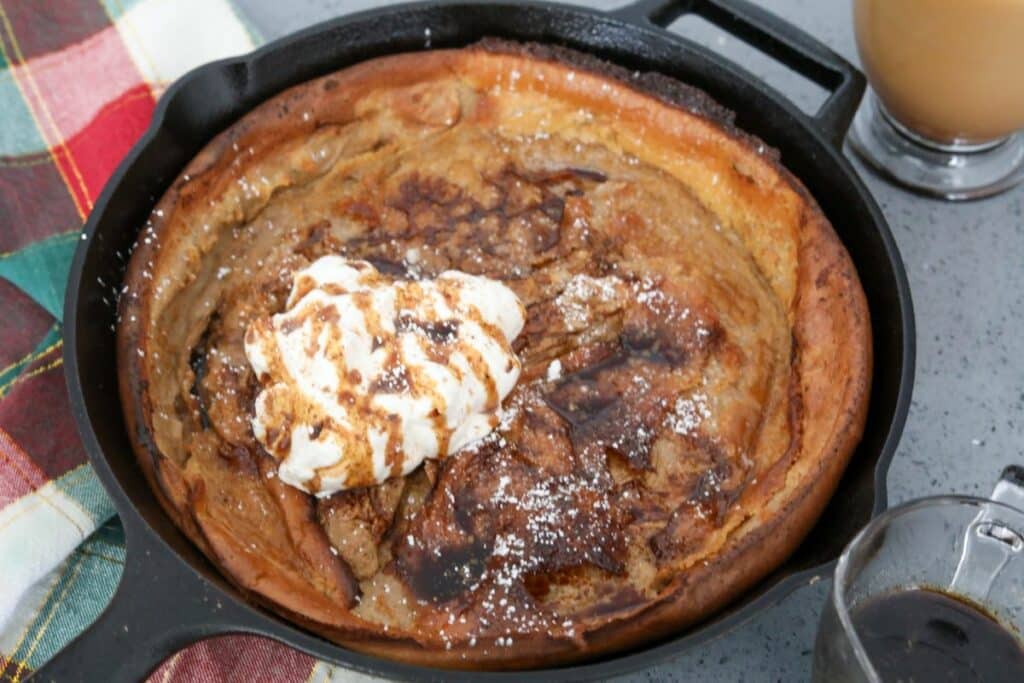 Gingerbread Dutch baby with whipped cream and syrup
