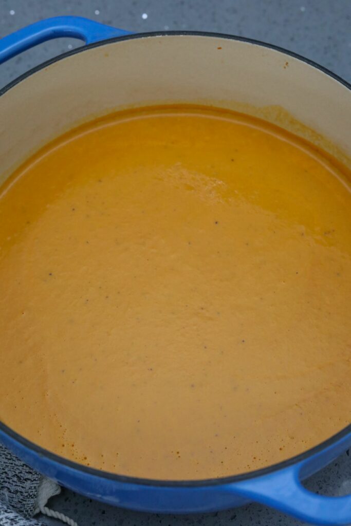 Blended lobster bisque in a Dutch oven