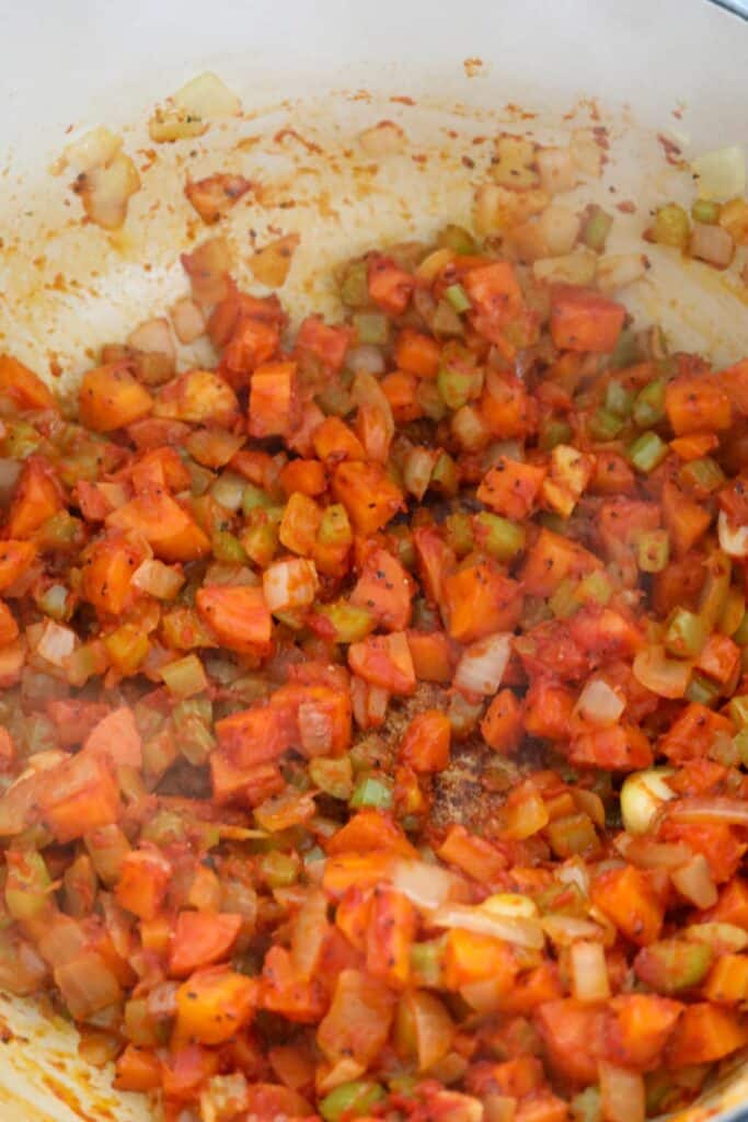 Mirepoix with browning tomato paste in a Dutch oven
