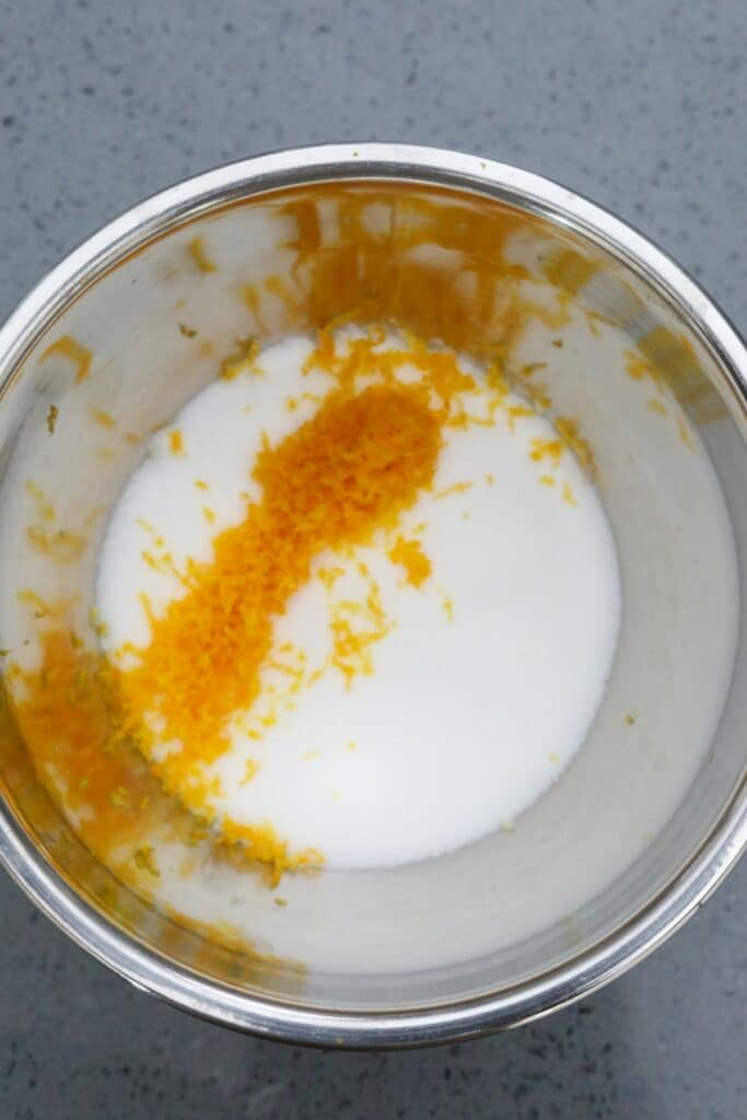 Orange zest and sugar in a mixing bowl