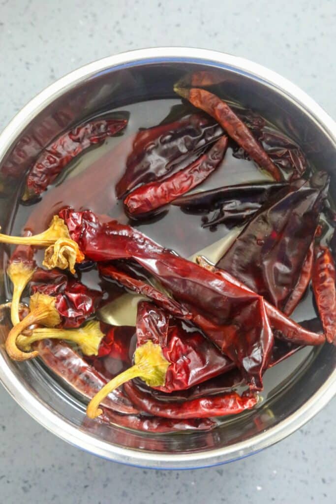 Peppers soaking in a mixing bowl