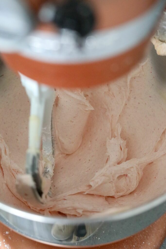 Strawberry buttercream in a mixing bowl