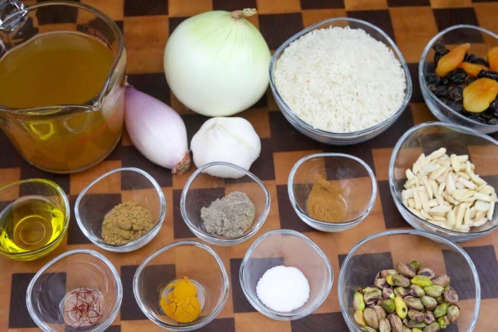 Ingredients for Moroccan rice pilaf on a wooden cutting board